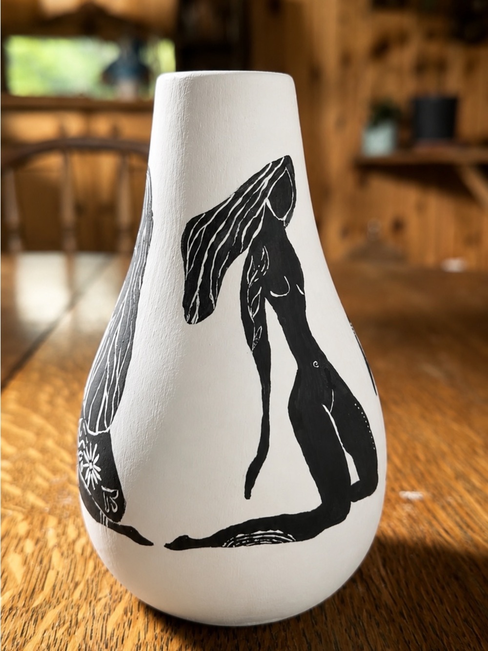 Hand-Painted White Ceramic Vase with Black Figure Motif